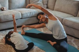 A Little girl is wearing a legging in yoga class