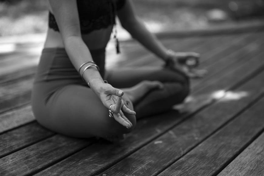 Doing yoga on wooden floor