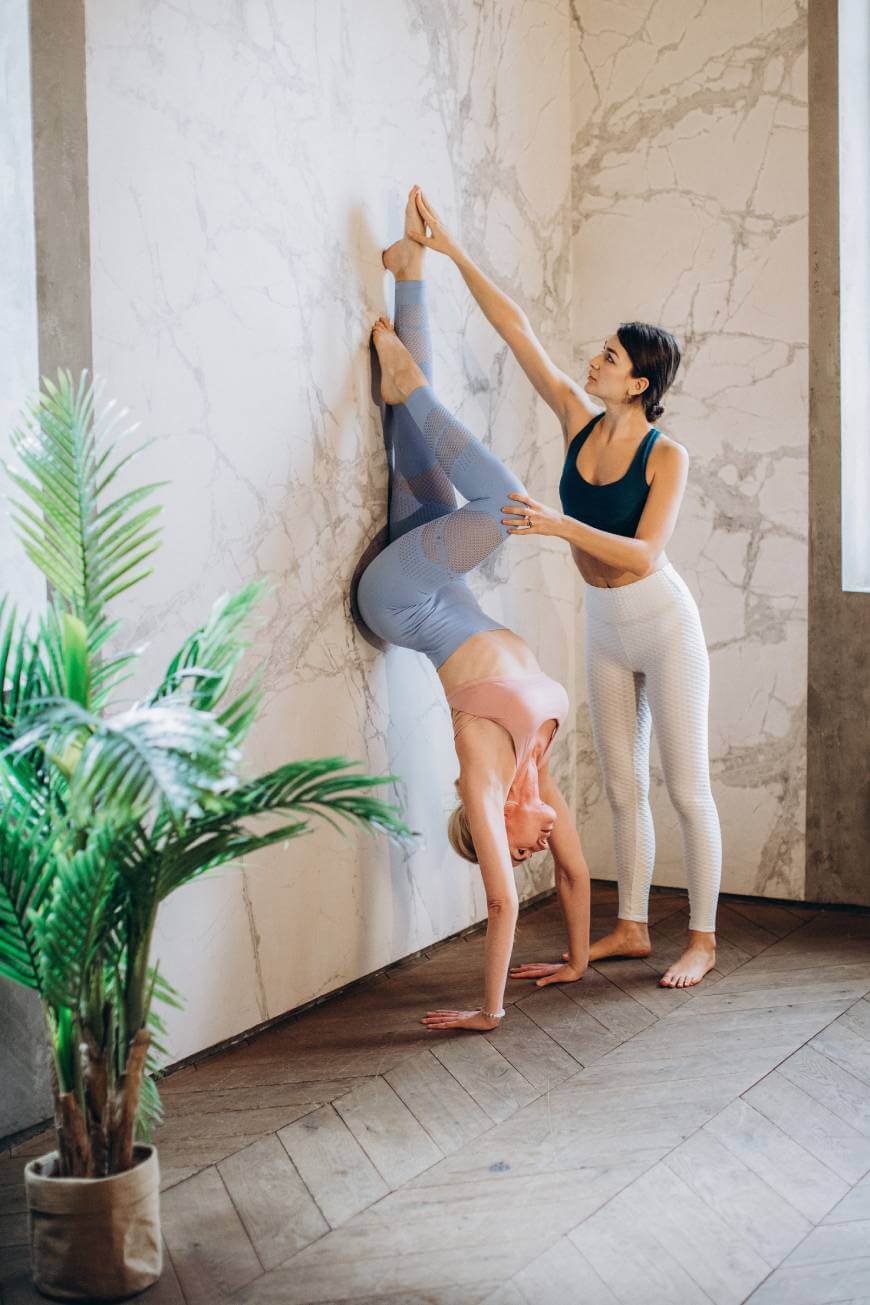 Doing yoga with wall